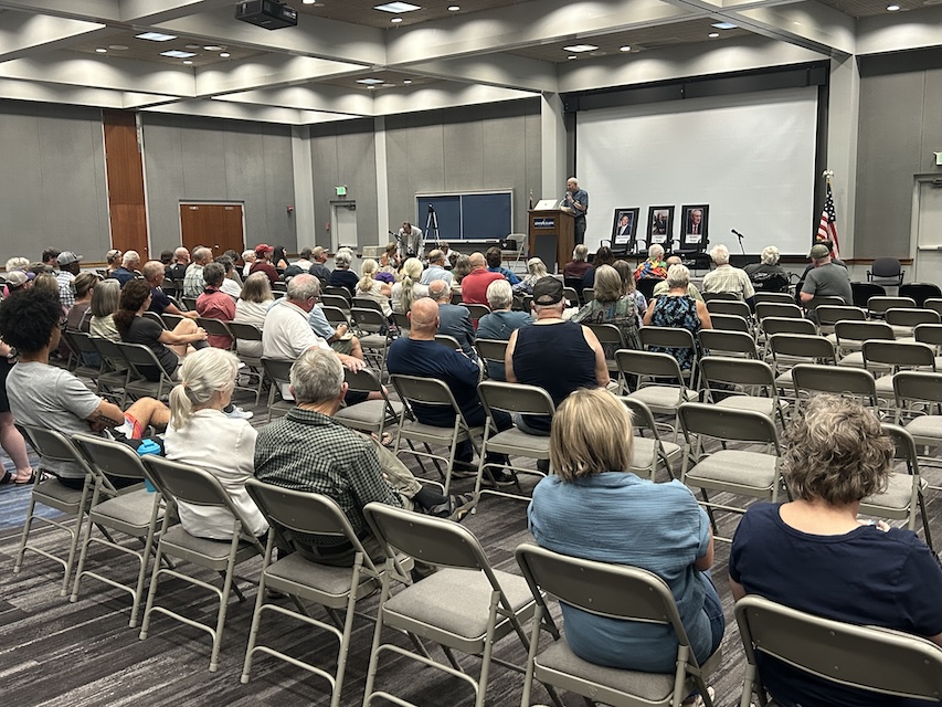 Attendees at the Members of Congress Forum listen as Leonard Garrison speaks.